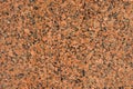 Natural stone red granite background. Bright hard red granite rock texture Royalty Free Stock Photo