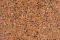 Natural stone red granite background. Bright hard red granite rock texture Royalty Free Stock Photo