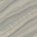 Natural stone surface featuring a pattern of wavy, parallel lines in various shades of Royalty Free Stock Photo