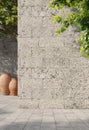 Natural stone travertine wall with tree leaves, sunlight with shadows. Summer, spring background Royalty Free Stock Photo