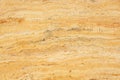 Natural stone travertine yellow color with an interesting pattern, called Travertino Giallo Royalty Free Stock Photo