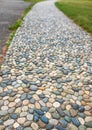 Natural stone walkways in the park. Stones path in garden.Polished stone gray pebble stone pavement Royalty Free Stock Photo