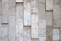 Natural uneven stone wall texture of beige scale colors porous material