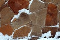 Natural stone wall from pieces covered with snow - Image Royalty Free Stock Photo