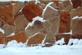 Natural stone wall from pieces covered with snow - Image Royalty Free Stock Photo