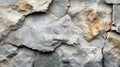 Natural stone wall texture showcasing rough, rustic features with variations in color and texture in daylight conditions Royalty Free Stock Photo