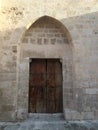 natural stone wall  traditional construction techniques  garden gate made of wood Royalty Free Stock Photo