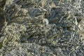 Natural stones and rock fragments of different sizes on the mountain slopes near the Black Sea as an original and textural backgro Royalty Free Stock Photo