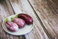 Natural striped vegetable eggplant on a decorative plate