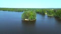 Magic aerial top view flight drone. Summer Paradise Wooded Island in Lake