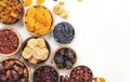 Natural sun dried fruits assortment in bowls on white background. Healthy wholesome snacks. Copy space Royalty Free Stock Photo