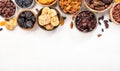 Natural sun dried fruits assortment in bowls on white background. Healthy wholesome snacks. Copy space Royalty Free Stock Photo