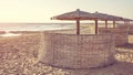 Natural sun umbrellas and windscreens on beach, color toning applied, Marsa Alam, Egypt