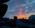 Natural Sunny Light Pillar During Sunrise. Atmospheric Optical Phenomenon