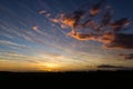 Natural Sunset Sunrise Over Field Or Meadow. Bright Dramatic Sky And Dark Ground. Countryside Landscape Under Scenic Colorful Sky Royalty Free Stock Photo