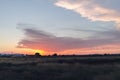 Natural Sunset Sunrise Over Field Or Meadow. Bright Dramatic Sky And Dark Ground. Countryside Landscape Under Scenic Colorful Sky Royalty Free Stock Photo