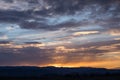 Natural Sunset Sunrise Over Field Or Meadow. Bright Dramatic Sky And Dark Ground. Countryside Landscape Under Scenic Colorful Sky Royalty Free Stock Photo