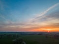 Natural Sunset Sunrise Over Field Or Meadow. Bright Dramatic Sky And Dark Ground. Countryside Landscape Under Scenic Royalty Free Stock Photo