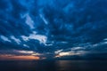 Natural sunset or sunrise time over calm sea water and mountains