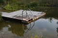 Natural swimming pool pond stairs wooden platform pier NSP garden water biotope