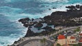 Natural swimming pools between rocks in small village Porto Moniz, Madeira, Portugal, with the wild Atlantic Ocean. Royalty Free Stock Photo