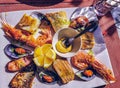 Tasty assorted seafood on the plate in the restaurant in Portugal