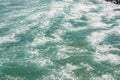 Sea texture, beautiful turquoise water waves with white foam, powerful nature concept, full frame, ocean