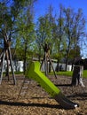 Natural toddler playground with green slide