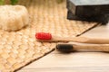 Natural toothbrushes made with bamboo on table