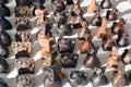 Natural traditional clay pottery beautiful old brown children`s toys, whistles in the form of animals, pigs, sheep, birds. Royalty Free Stock Photo