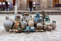 Natural traditional clay pottery beautiful old kitchen appliances, dishes, jugs, vases, pots, mugs. The background. Royalty Free Stock Photo