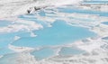 Natural travertine pools and terraces view from Pamukkale, Denizli, Turkey. Cotton castle at sunny bright day