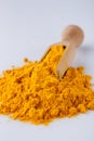 Natural turmeric powder on white acrylic background Royalty Free Stock Photo