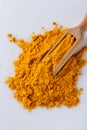 Natural turmeric powder on white acrylic background Royalty Free Stock Photo