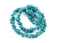 Natural turquoise beads on a white background