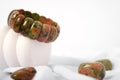 Natural unakite stone bracelet on isolated white background. Unisex. Isoteric