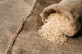 Natural unpolished brown rice on sack. healthy eating and food concept