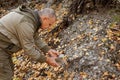 Natural unprocessed pieces of mica minerals in the hands of a man in a natural deposit