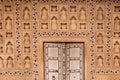 natural Valencia cream marble wall and door with symmetrical arabesque intricate inlay reliefs