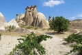 Rocks looking like mushrooms dramatically lit by a sun in Chavushin in Cappadocia, Turkey.