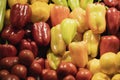 Natural vegetable background from colorful fresh organic sweet bell peppers. Farmers market counter, vegetables closeup Royalty Free Stock Photo