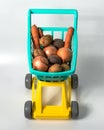 Natural vegetables from the hypermarket in a baby grocery cart Royalty Free Stock Photo