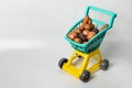 Natural vegetables from the hypermarket in a baby grocery cart Royalty Free Stock Photo