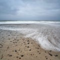 Natural view of the beach in Bjerregard, Denmark under a cloudy sky Royalty Free Stock Photo