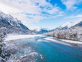 Natural view of a calm winter lake and mountain landscape under a blue sky Royalty Free Stock Photo