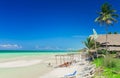 Natural view of tropical beach and turquoise tranquil with people relaxing and enjoying their time