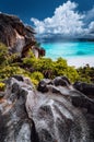 Natural viewpoint to beautiful impressive Grand Anse beach on La Digue island in Seychelles. Amazing white clouds above Royalty Free Stock Photo