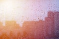 Natural water drops background on glass. Blurred city background Royalty Free Stock Photo