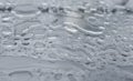 Natural water drops on a glass table after rain. Royalty Free Stock Photo