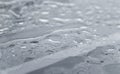 Natural water drops on a glass table after rain. Royalty Free Stock Photo